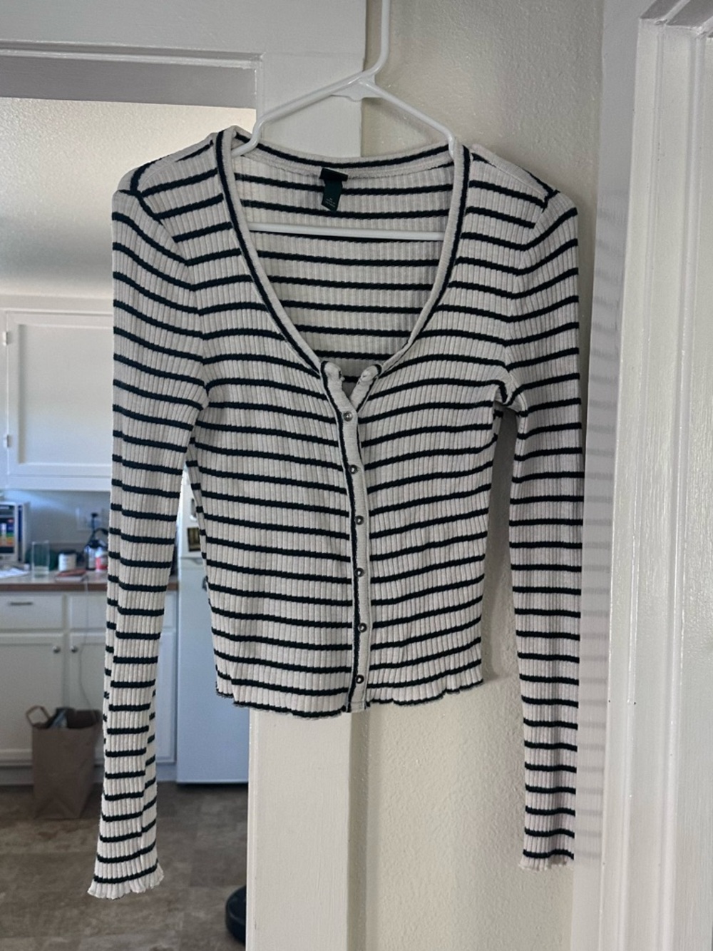 Long sleeve button up top. Size Medium